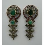 A pair of vintage drop earrings set in silver and gold, with rubies, diamonds and emeralds.