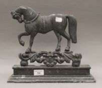 A 19th century horse form doorstop. 33 cm wide.