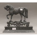 A 19th century horse form doorstop. 33 cm wide.