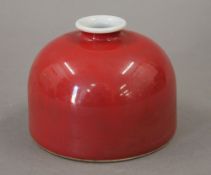 A Chinese red porcelain ink pot. 7.5 cm high.