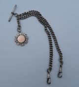 A silver double Albert chain with silver fob. 47 grammes.