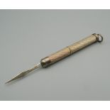 A silver cigar pricker. 7.5 cm long extended.