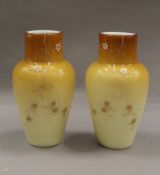 A pair of 19th century hand painted vaseline glass vases. 15 cm high.