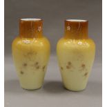 A pair of 19th century hand painted vaseline glass vases. 15 cm high.