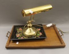 A brass adjustable student's lamp, two trays and a modern plate rack. The latter 57 cm wide.