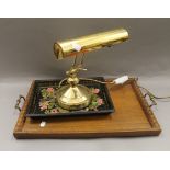 A brass adjustable student's lamp, two trays and a modern plate rack. The latter 57 cm wide.