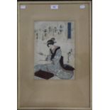 A Japanese woodblock print of a lady, framed and glazed. 21.5 x 31.5 cm.