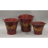 A set of three Coca-Cola buckets. The largest 30 cm high.