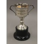 A small silver trophy cup, on stand. 16.5 cm high. 80.7 grammes of weighable silver.