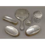 A silver dressing table set,