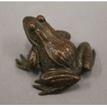 A small bronze model of a frog. 3.5 cm long.