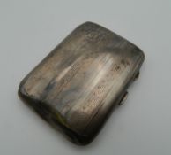 A silver cigarette case. 6 cm wide. 45.5 grammes total weight.
