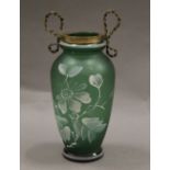 A Victorian blown and hand painted green glass vase with brass bow collar. 14.5 cm high.