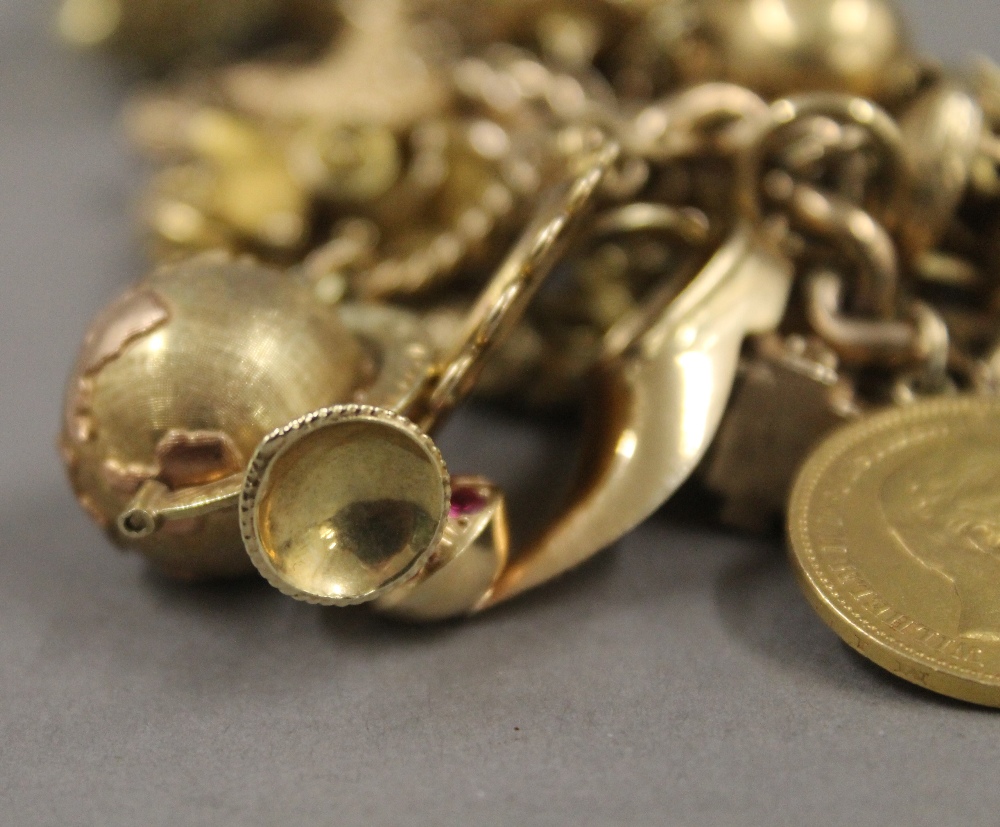 A 9 ct gold charm bracelet, set with various gold coins, including two sovereigns. 218. - Image 20 of 20