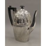 A silver coffee pot. 22 cm high. 17.7 troy ounces total weight.