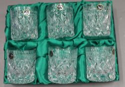 Three boxed cut crystal drinking glass sets.