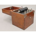 A vintage mahogany cased electric shock machine. 19 cm high.