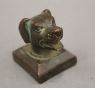 A bronze seal formed as a dog's head. 3.75 cm high.