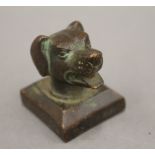 A bronze seal formed as a dog's head. 3.75 cm high.