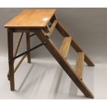 A set of small wooden steps. 51 cm high.