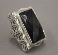 A silver dress ring. Ring size P/Q.