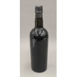 A single bottle of 1920 vintage port. 29 cm high.