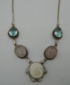 A silver stone set necklace. 44 cm long.