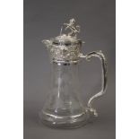 A silver plated lion top claret jug. 27 cm high.