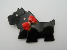 A Leo Stein scotty dog brooch. 8 cm wide.