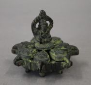 A small Indian bronze spice box. 5.5 cm high.