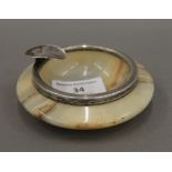 An early 20th century silver and onyx ashtray, hallmarked for Birmingham. 9.5 cm diameter.