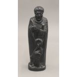 An Irish figure of Saint Colmcille. 16.5 cm high.