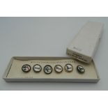 A boxed set of vintage Guinness waistcoat buttons