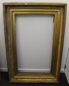 A large Victorian gilt frame. 146.5 x 97.5 cm overall. 113.5 x 65 cm internal rebate size.