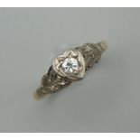 An unmarked, probably 18 ct gold diamond solitaire ring. Ring size H/I.