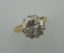 An 18 ct gold diamond solitaire ring, the claw set stone spreading to approximately 5 carats.