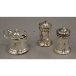 A cased three-piece silver cruet set.