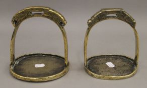 Two Mongolian bronze stirrups. 16 cm high.