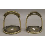 Two Mongolian bronze stirrups. 16 cm high.