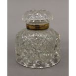 A Victorian cut glass inkwell. 9 cm high.