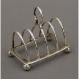 A miniature silver toast rack.