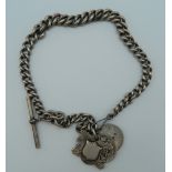 A silver Albert chain with coins, fobs, etc. 92 grammes.