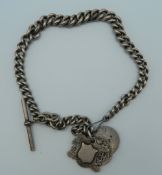 A silver Albert chain with coins, fobs, etc. 92 grammes.