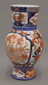 A 19th century Imari vase. 33.5 cm high.