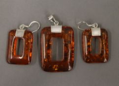 A dress pendant, with matching earrings. The pendant 4 cm high.