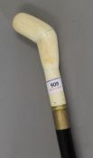 A walking stick with a bone handle. 103 cm high.