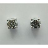 A pair of 18 ct white gold, diamond stud earrings. Total diamond weight 0.92 carats, VVS, Colour E.