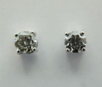 A pair of 18 ct white gold, diamond stud earrings. Total diamond weight 0.92 carats, VVS, Colour E.