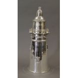 A silver plated cocktail shaker formed as a lighthouse. 33 cm high.