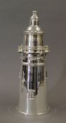 A silver plated cocktail shaker formed as a lighthouse. 33 cm high.